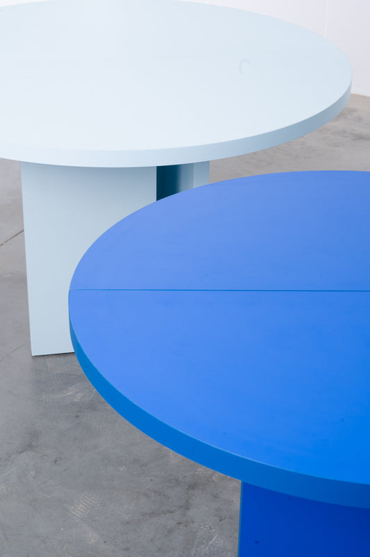 Colourful wooden round tables designed by Bobbie Bahama