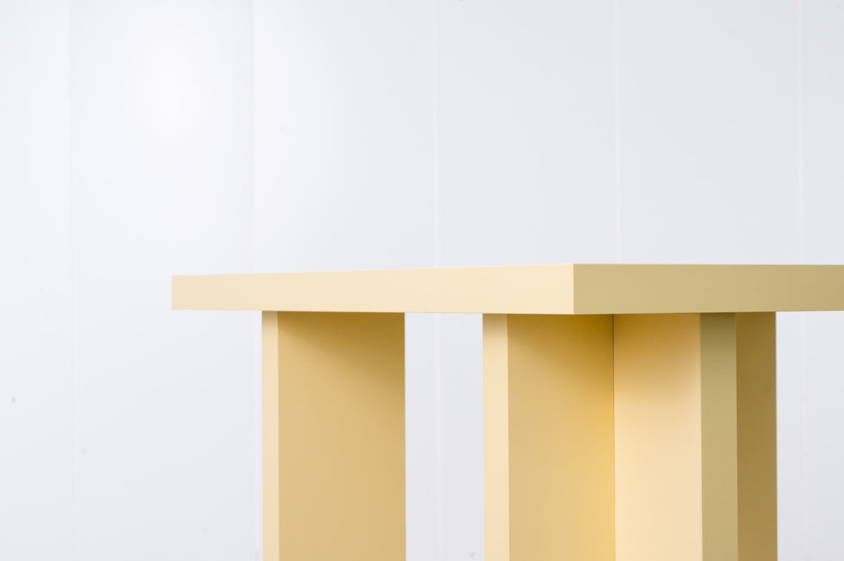 Rectangular wooden dining table in butter yellow designed by Bobbie Bahama