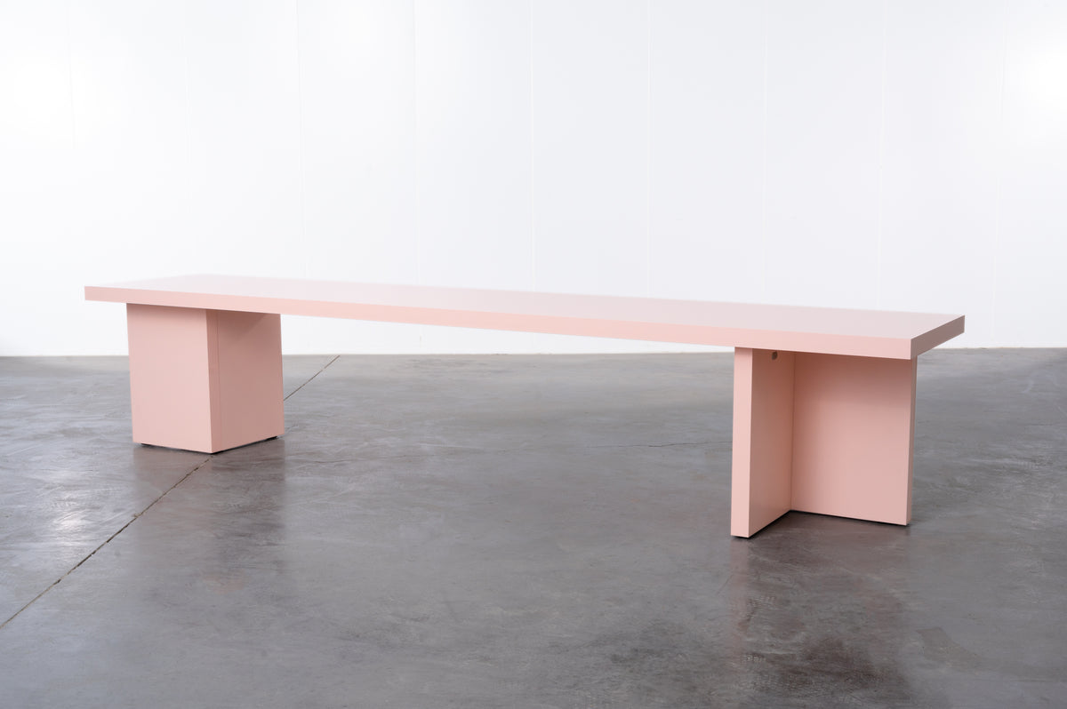 Pink wooden bench by Bobbie Bahama