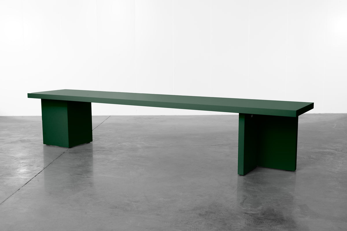 Dark green wooden bench by Bobbie Bahama