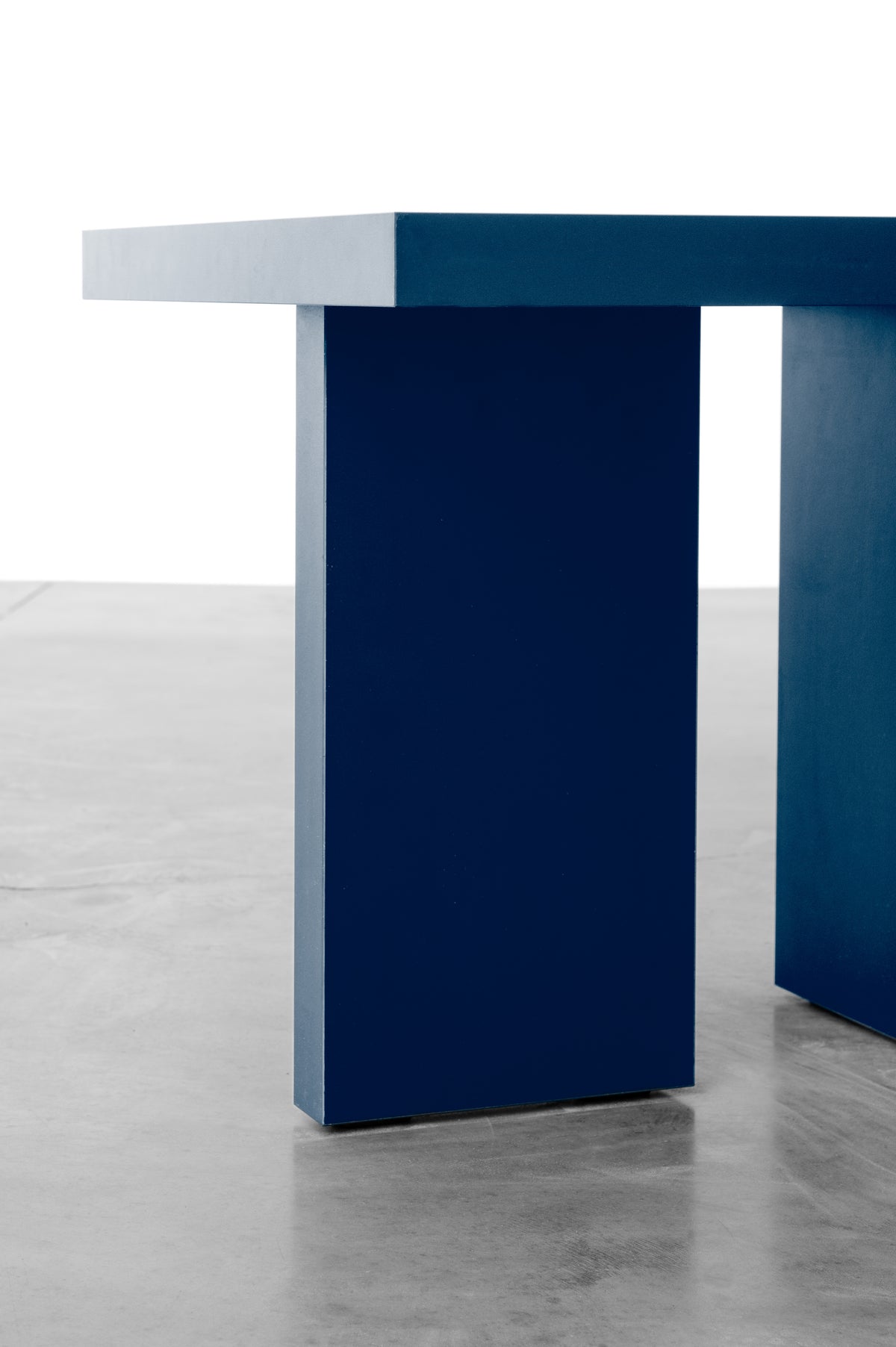 Deep dark blue wooden side table by Bobbie Bahama