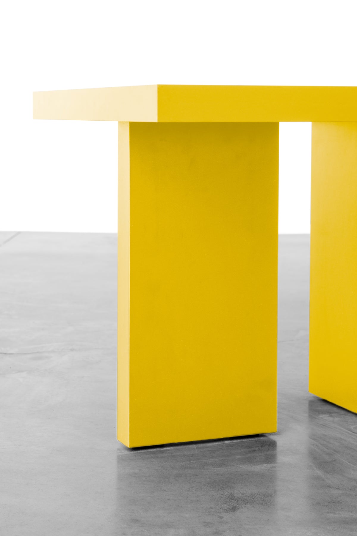 Bright yellow wooden side table by Bobbie Bahama