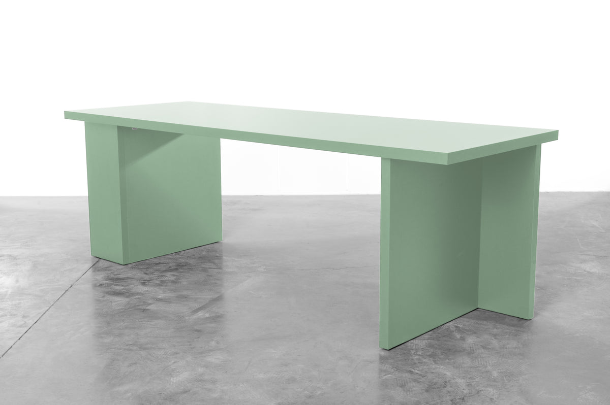 Large rectangular wooden dining table in mint green designed by Bobbie Bahama