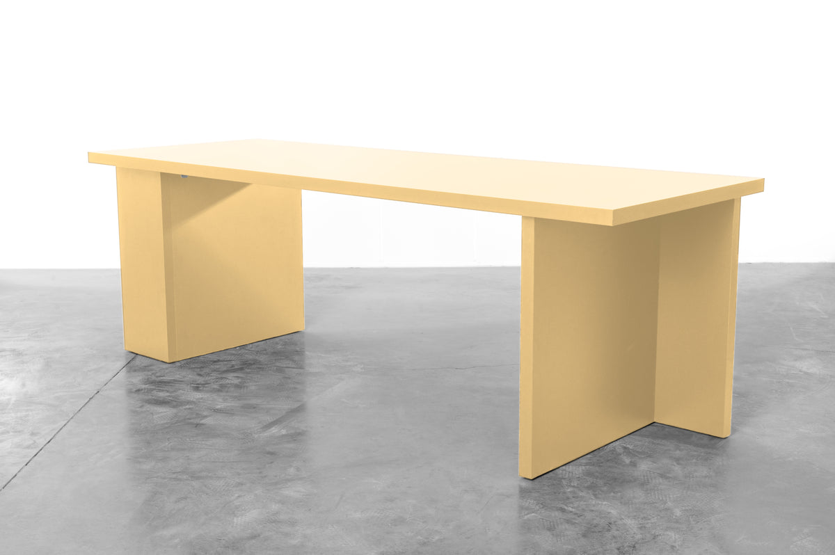 Large rectangular wooden dining table in butter yellow designed by Bobbie Bahama