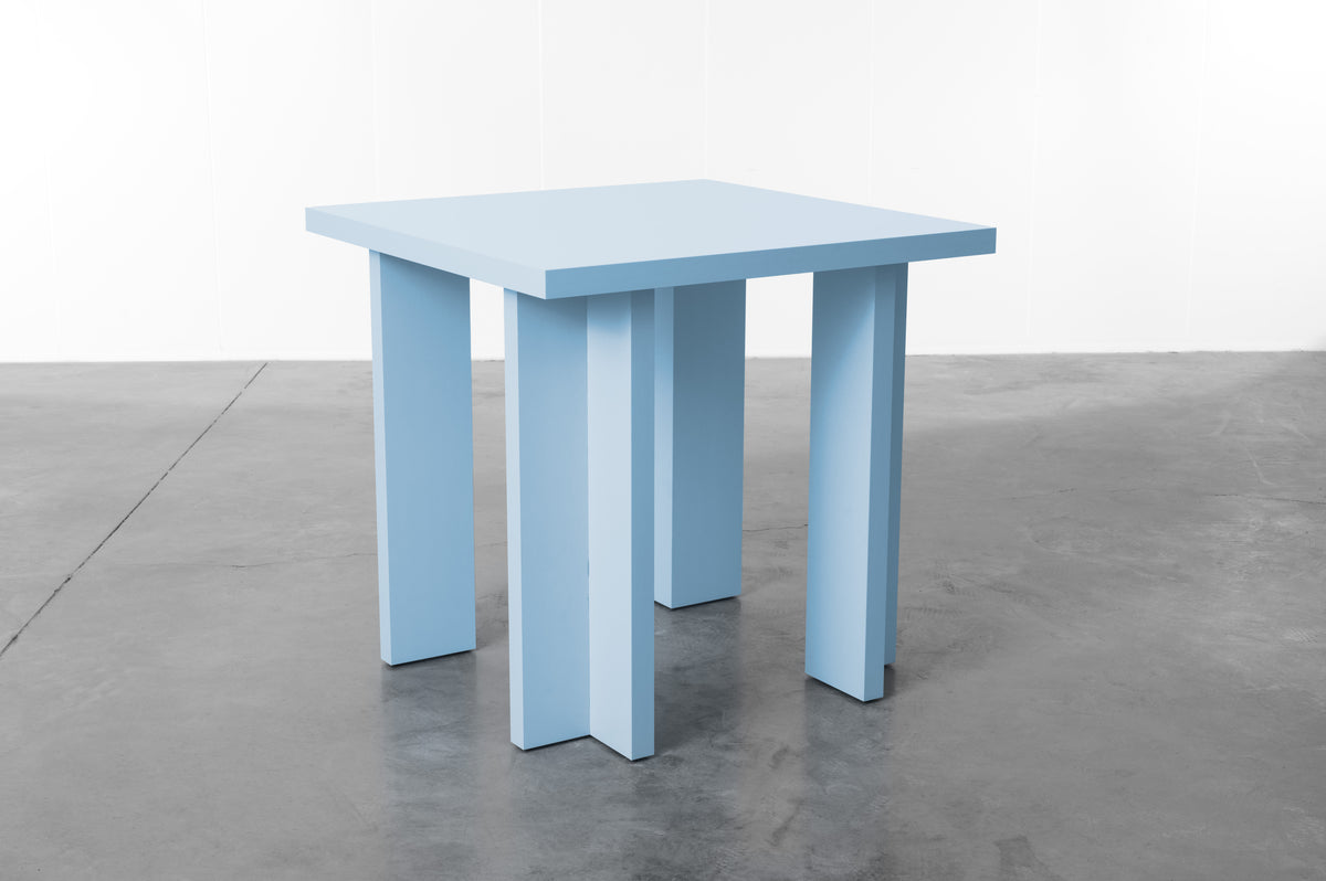 Rectangular wooden dining table in baby blue designed by Bobbie Bahama