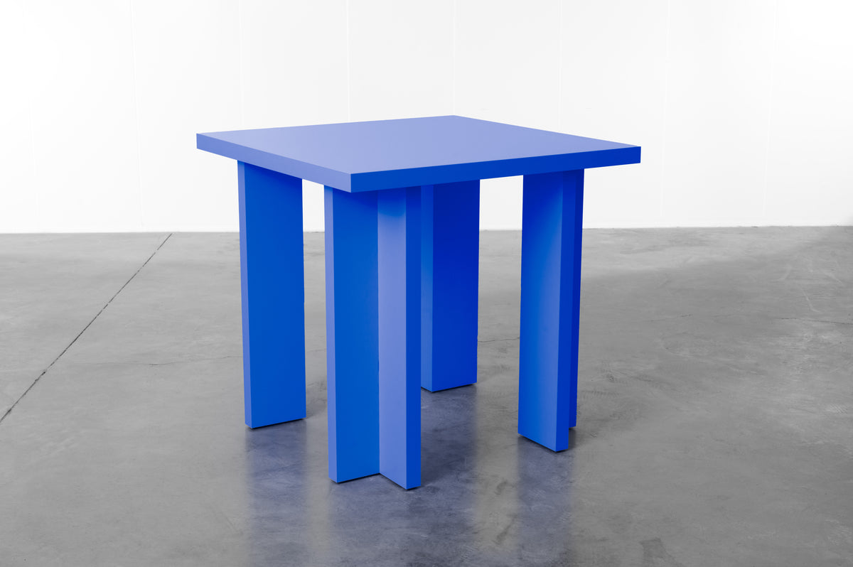 Rectangular wooden dining table in cobalt blue designed by Bobbie Bahama
