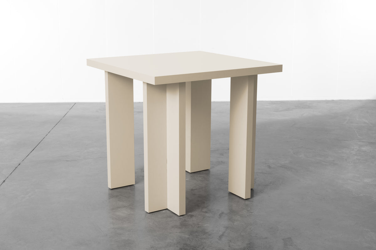 Rectangular wooden dining table in soft ecru designed by Bobbie Bahama