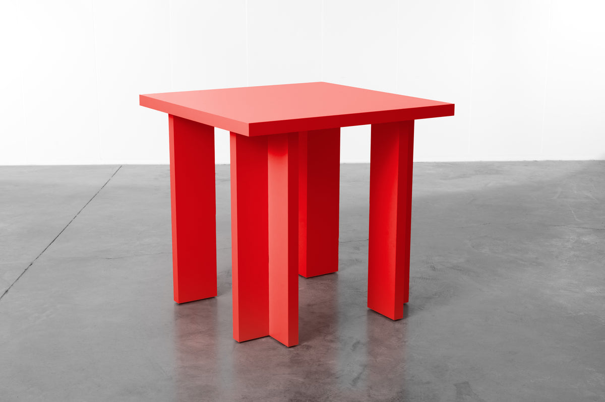 Rectangular wooden dining table in bright red designed by Bobbie Bahama
