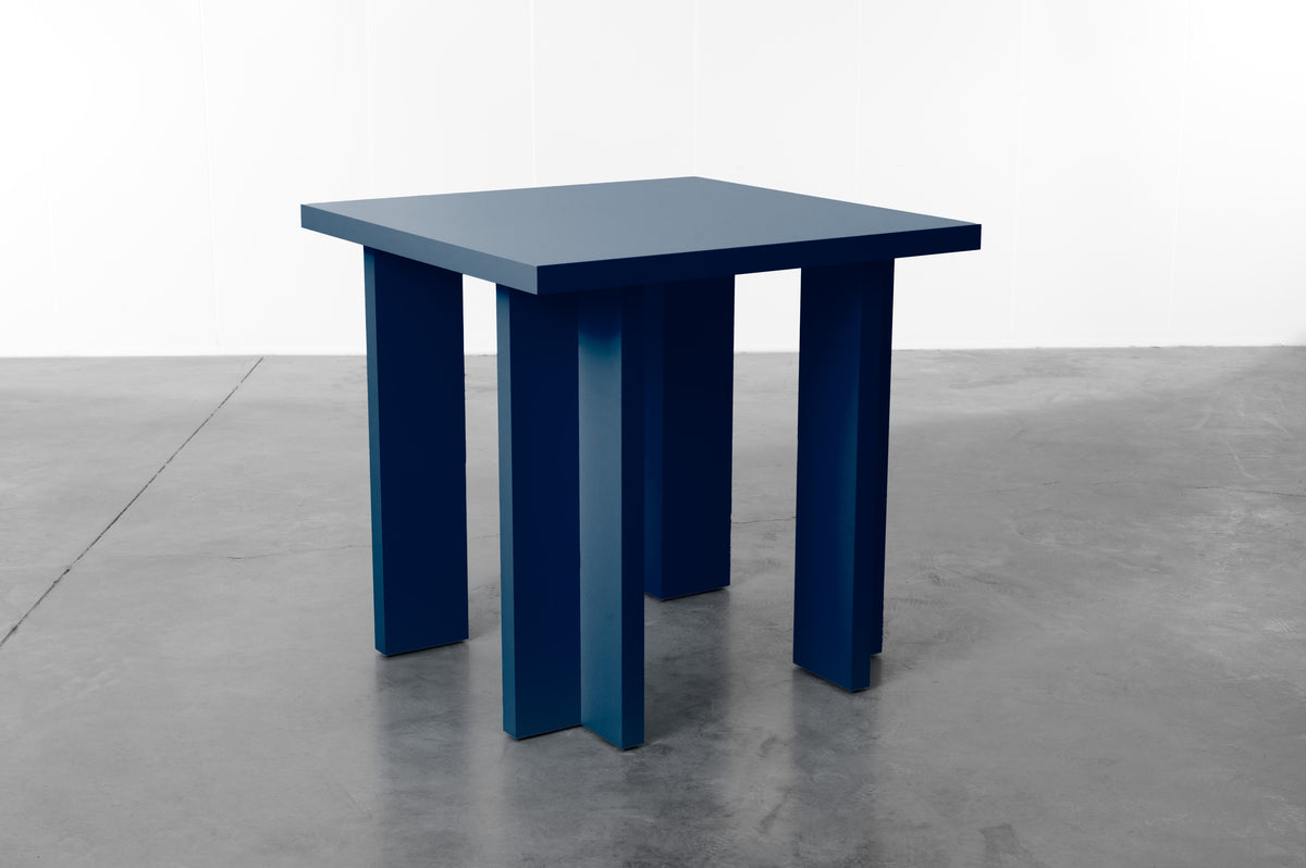 Rectangular wooden dining table in deep midnight blue designed by Bobbie Bahama