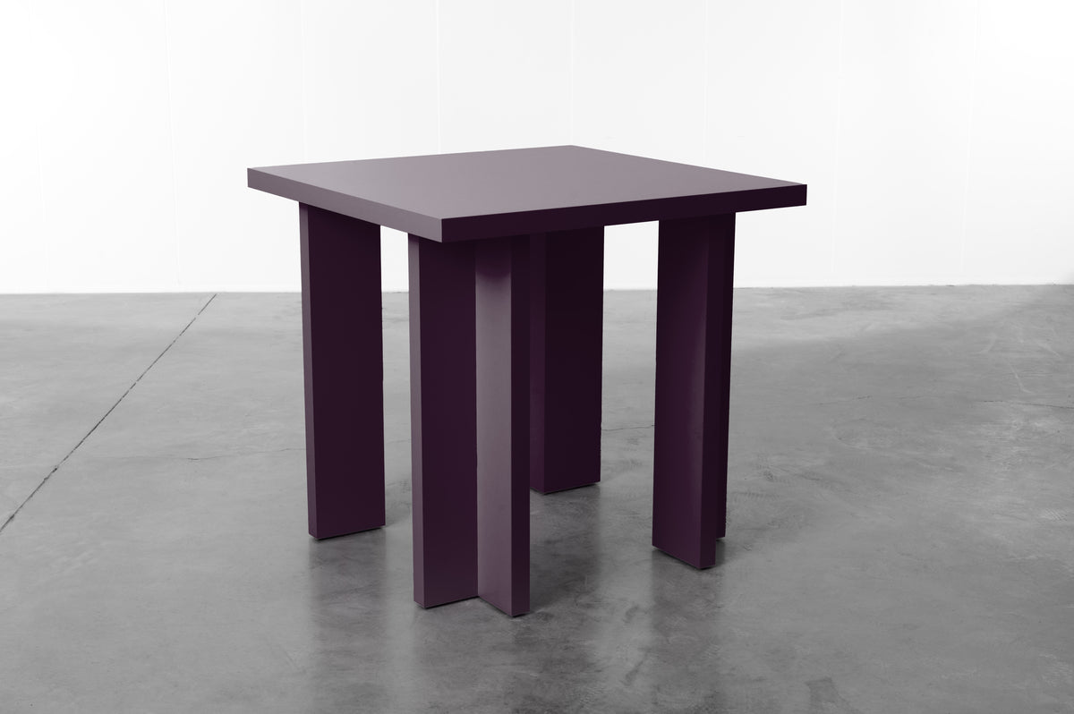 Rectangular wooden dining table in plum designed by Bobbie Bahama